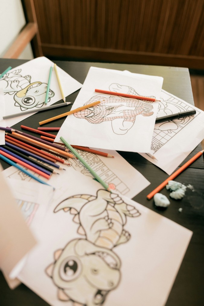 kids coloring pages and crayons used as travel entertainment for children