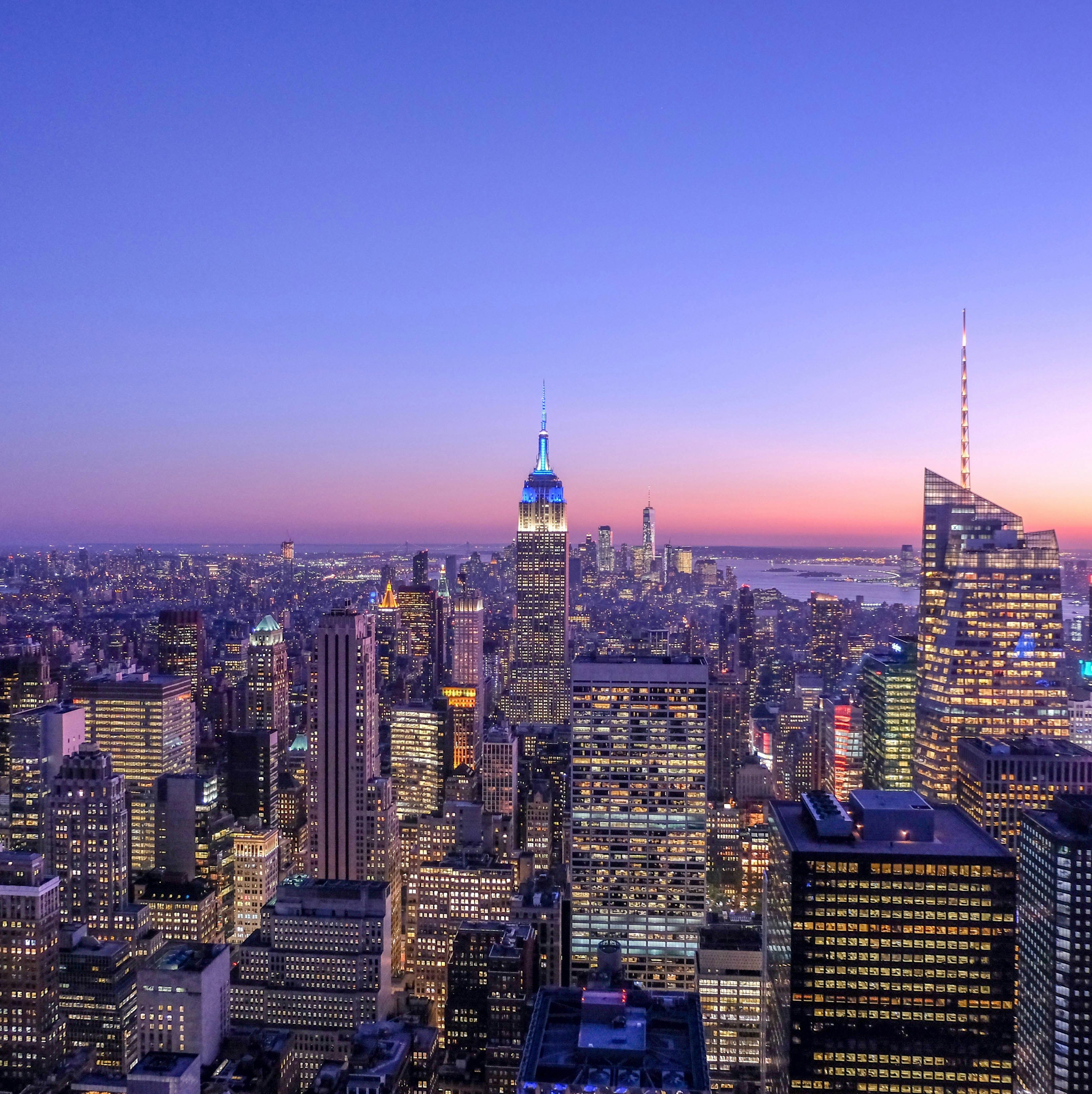New York City skyline from the harbor featuring One World Trade Center and lower Manhattan