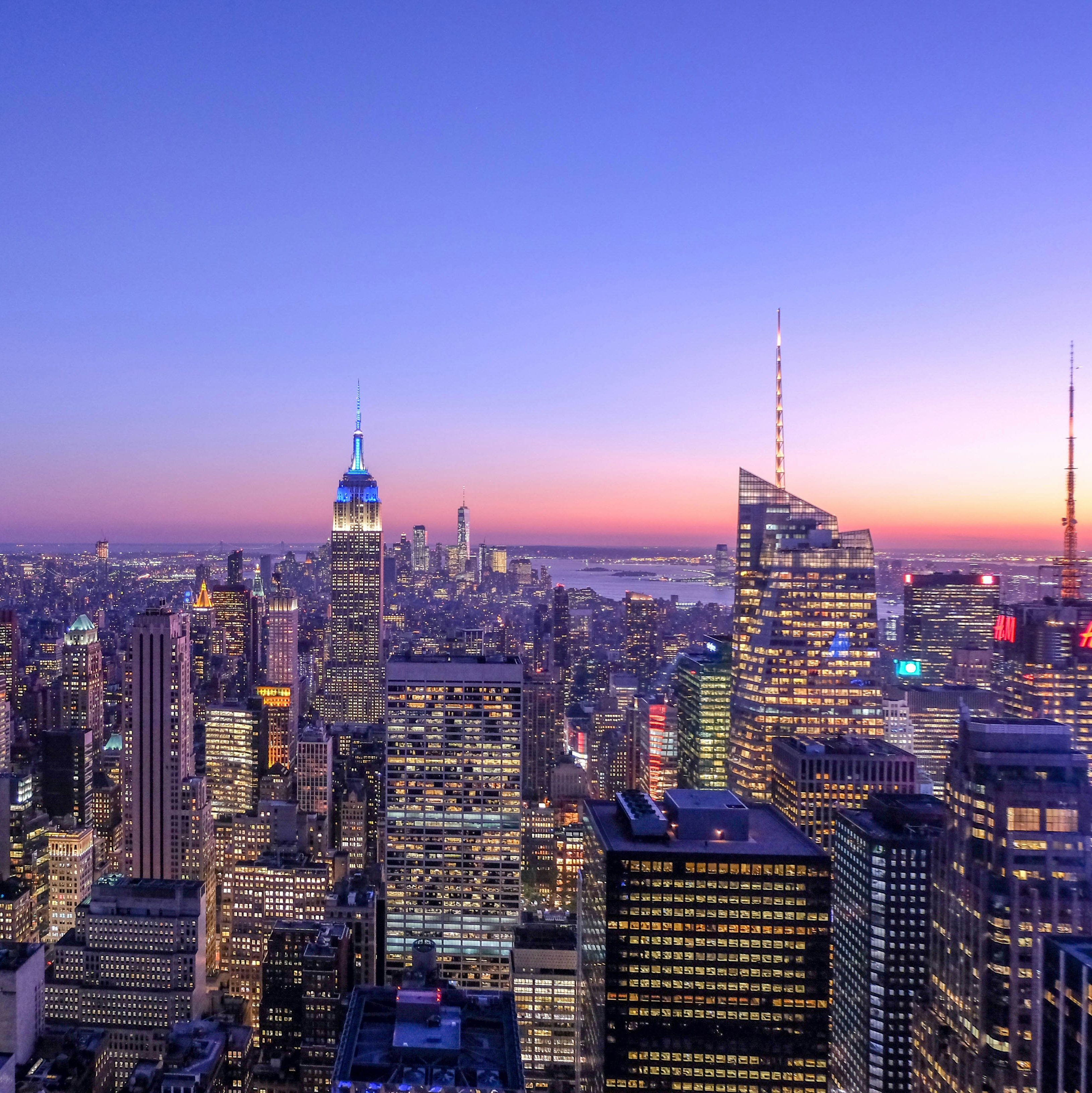 New York City skyline from the harbor featuring One World Trade Center and lower Manhattan