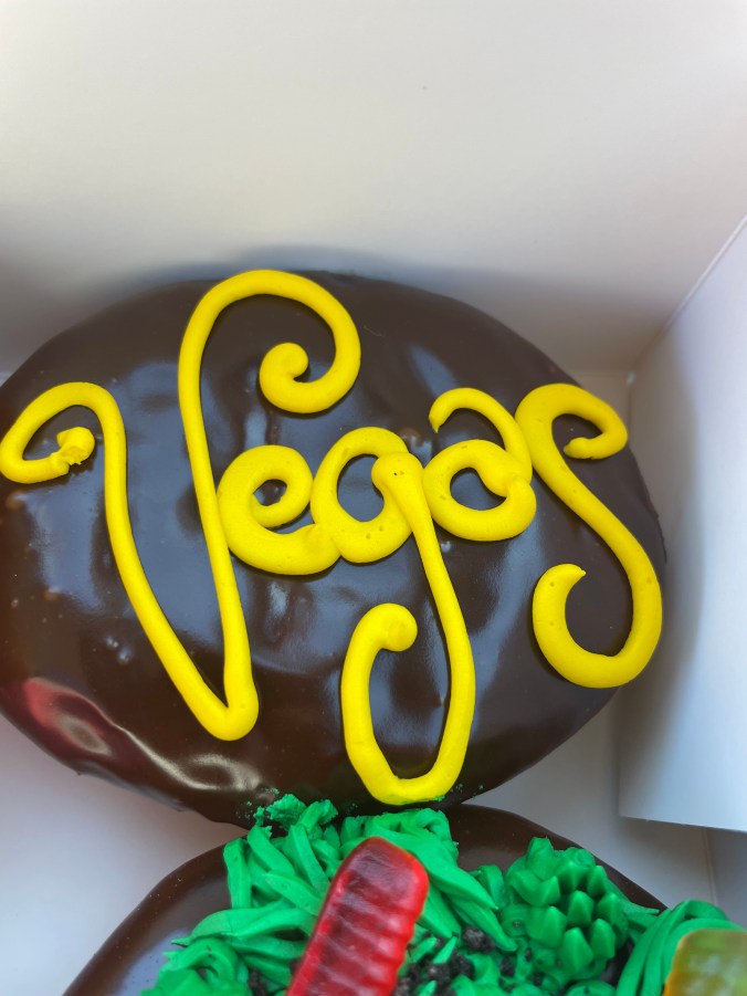 Donut with Vegas written on it from Pinkbox Doughnuts in Las Vegas