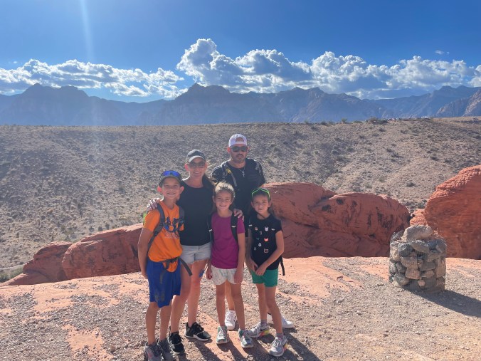 Kids hiking and climbing red rocks at Red Rock Canyon near Las Vegas