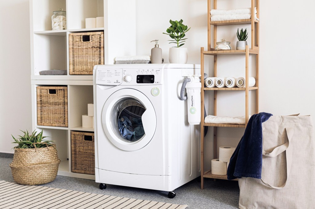 Laundry setup with washing machine and storage baskets for travel packing strategy