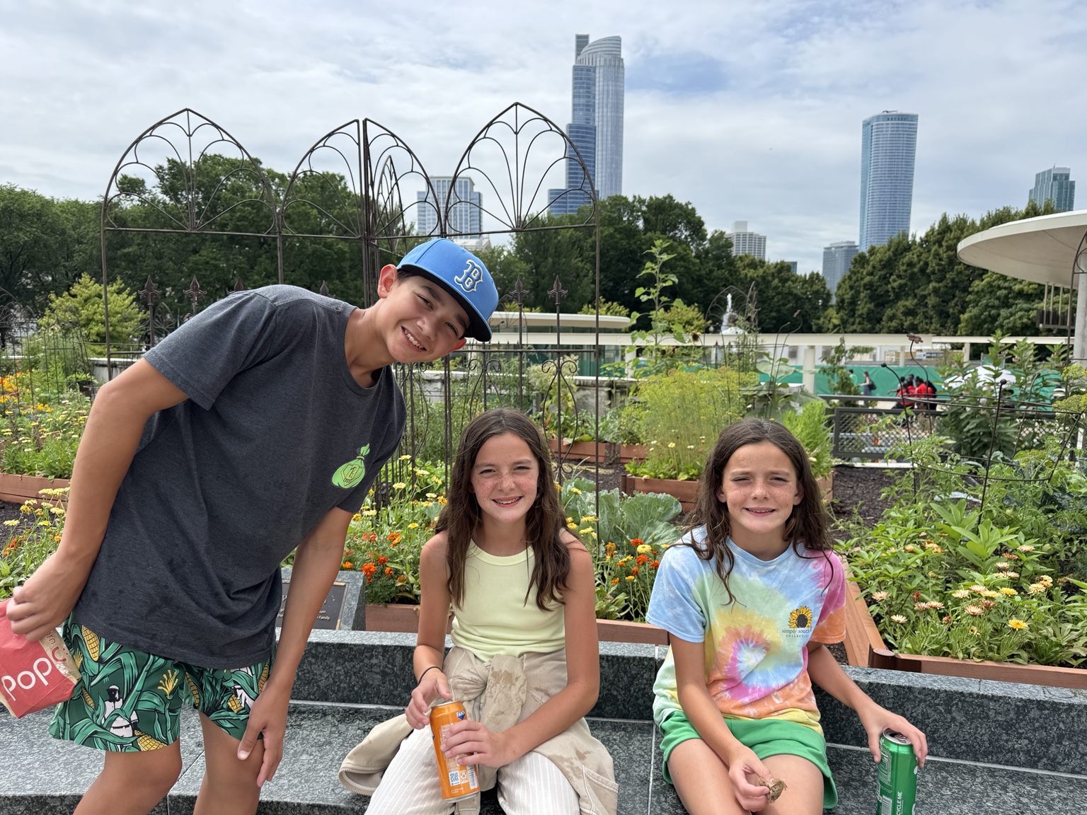 Family exploring Lincoln Park Zoo gardens with Chicago skyline views