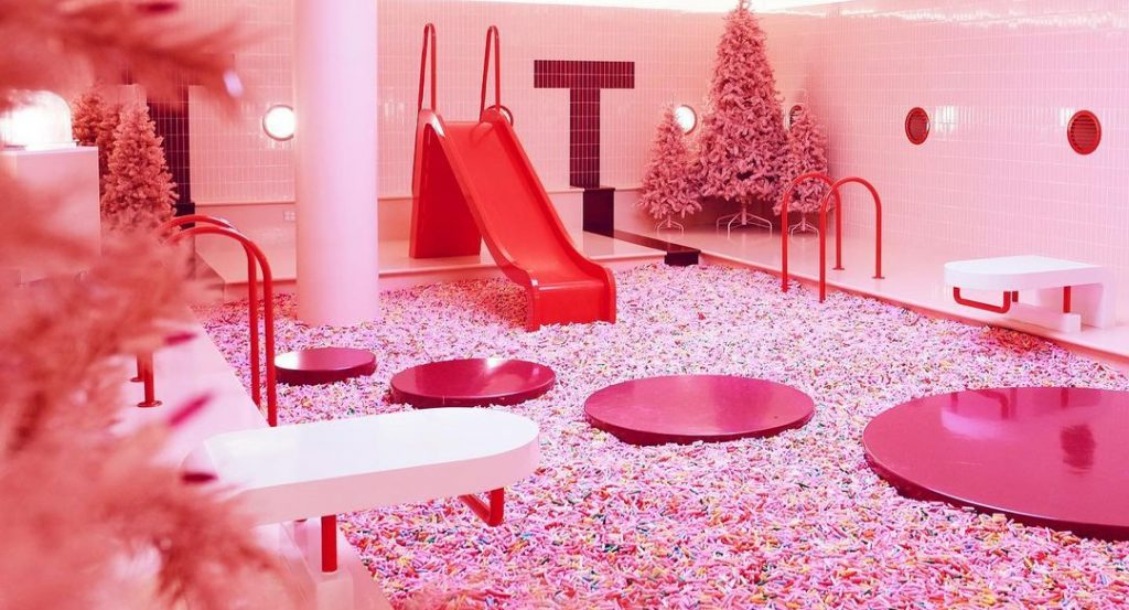 Colorful sprinkle pool inside Museum of Ice Cream Chicago attraction for kids and families