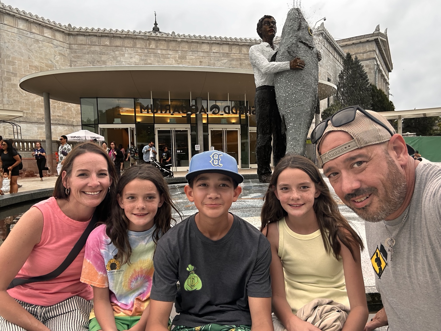 Family visiting Shedd Aquarium in Chicago with kids