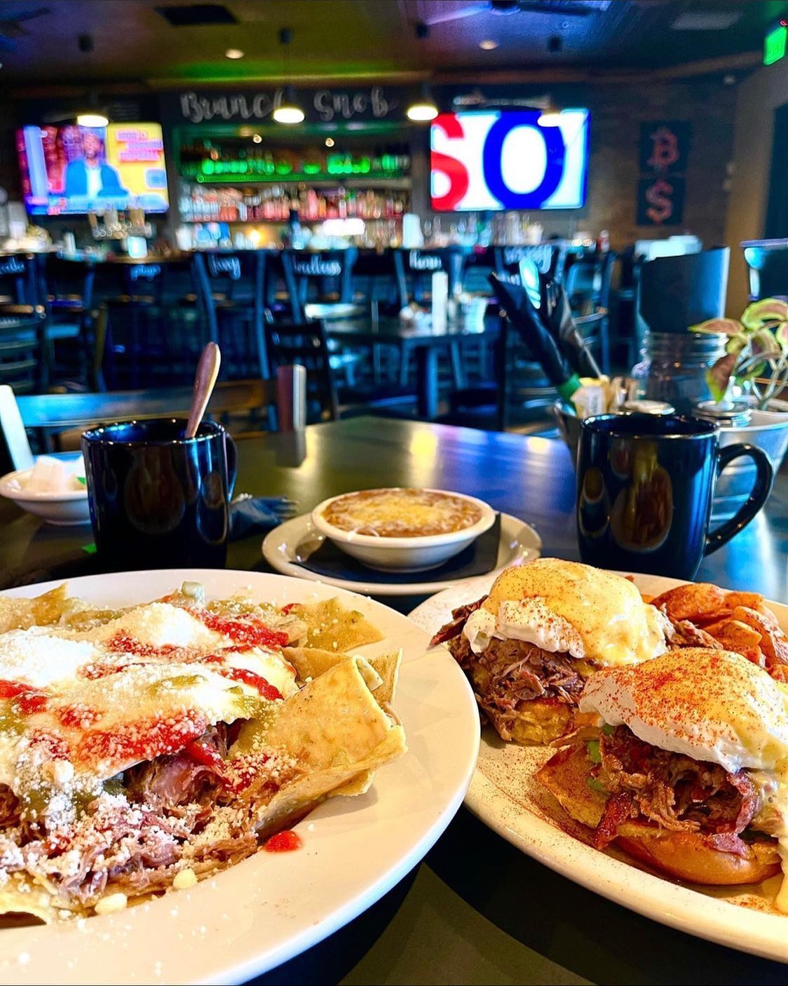 Brunch plates with eggs benedict and breakfast dishes at The Brunch Snob Phoenix Arizona
