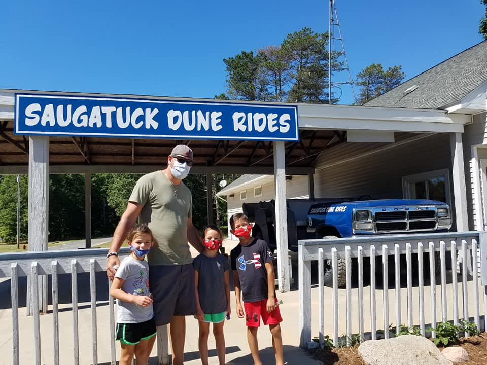 Saugatuck Dune Rides dune buggy parked before a family dune tour in Michigan