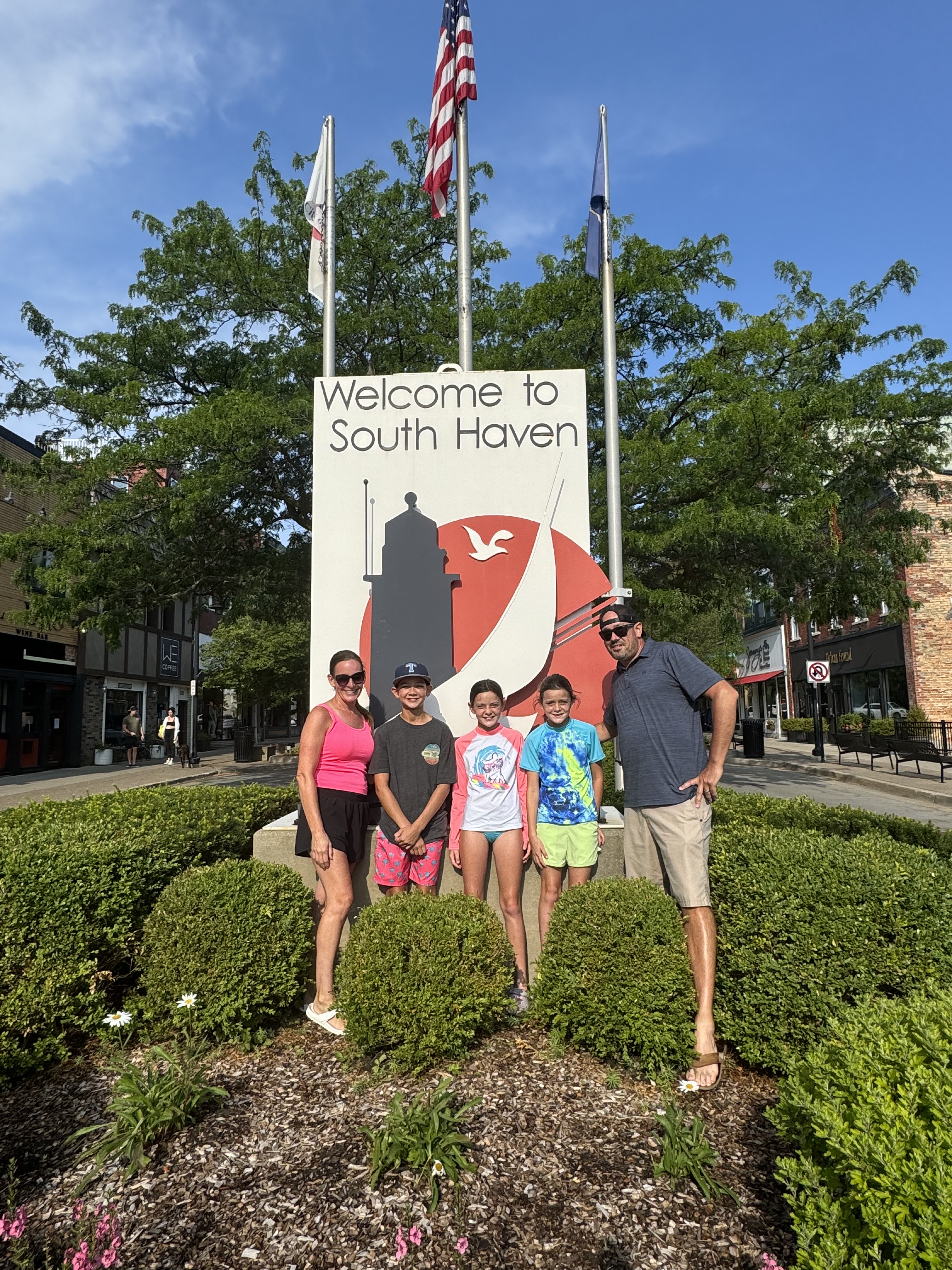 Downtown South Haven Welcome Sign Family standing in front of the Welcome to South Haven sign in downtown South Haven, Michigan.