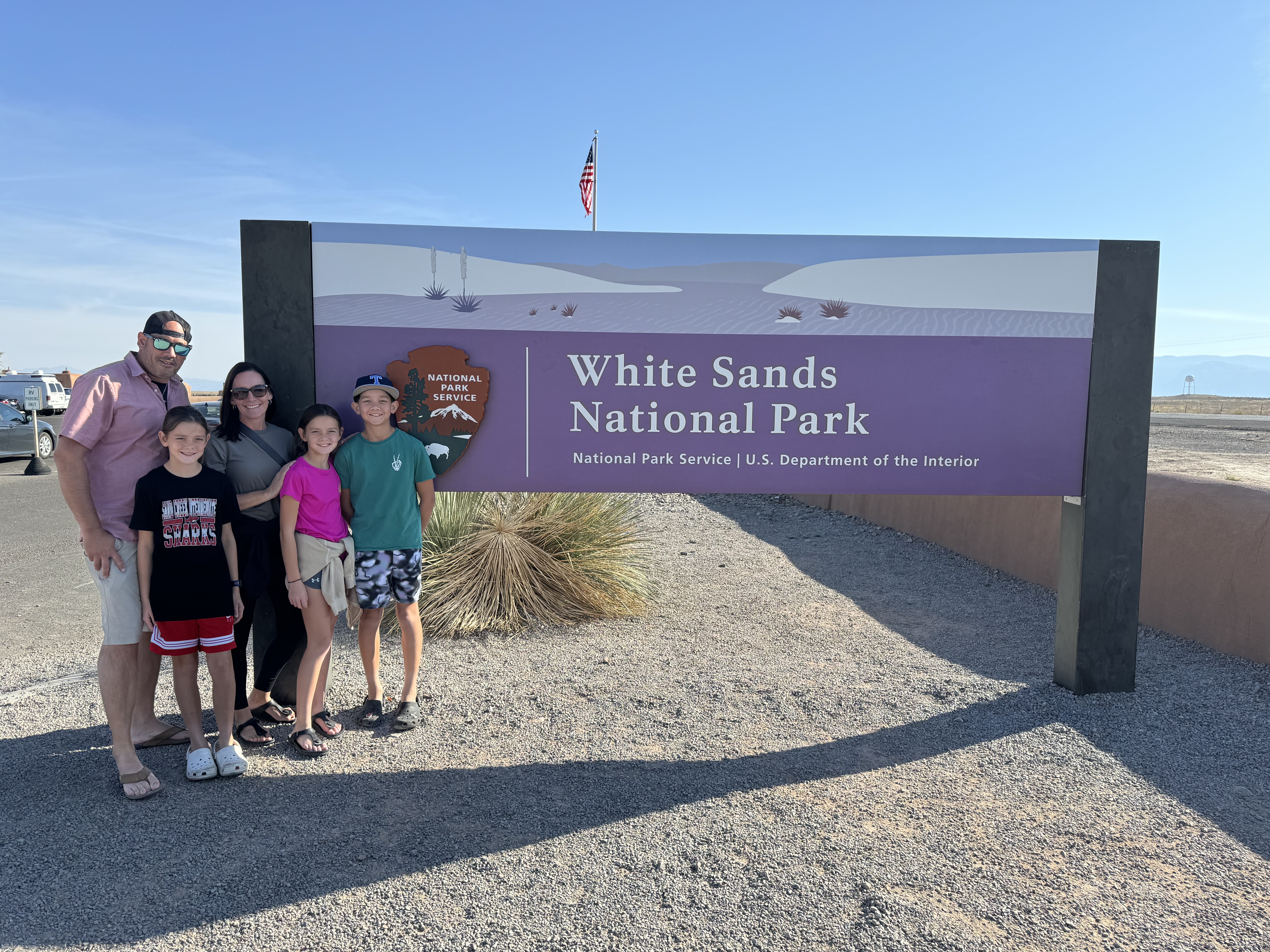 Family visiting White Sands National Park during a Southwest family road trip
