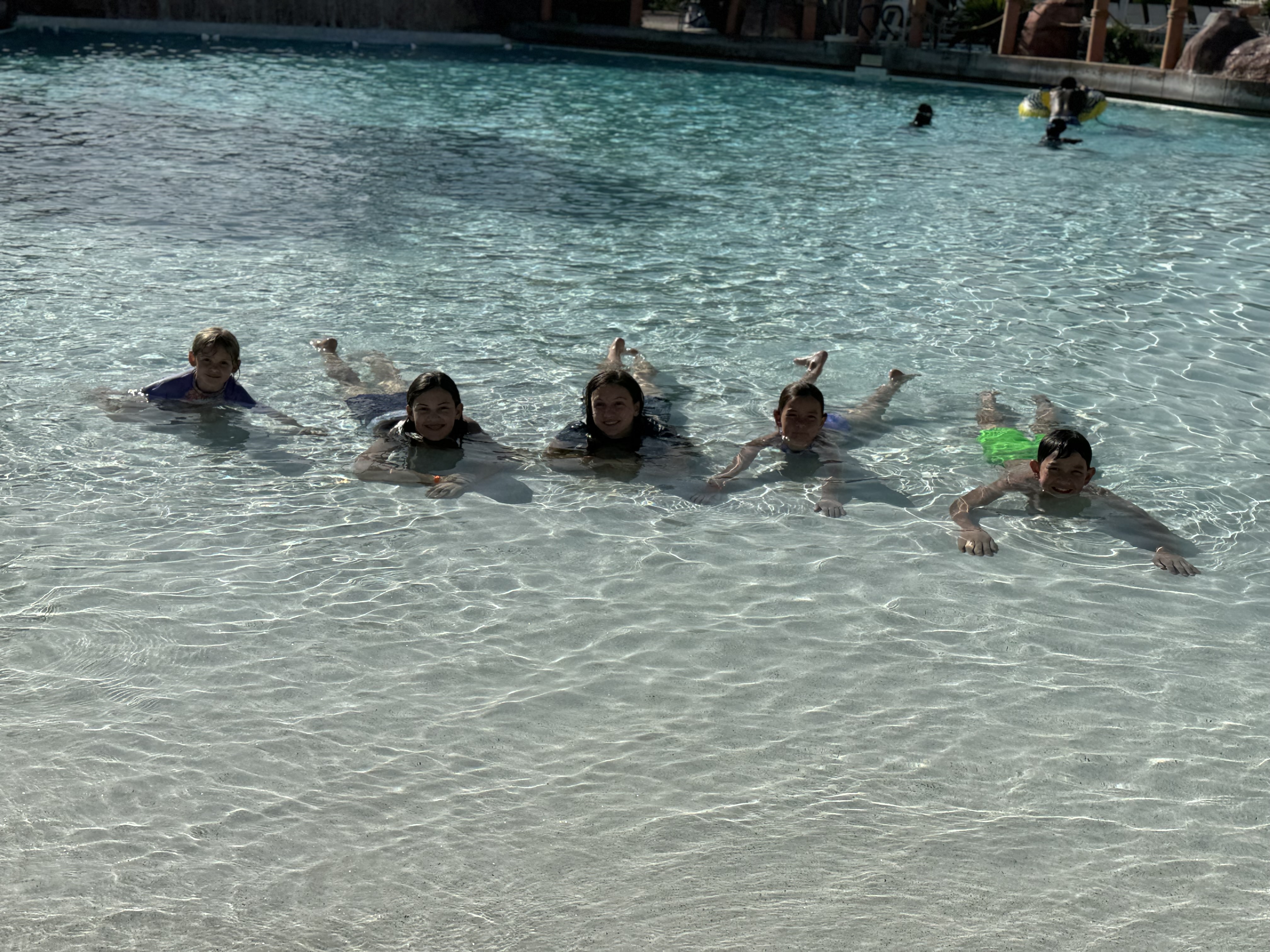 Kids swimming together at Arizona Grand Resort waterpark