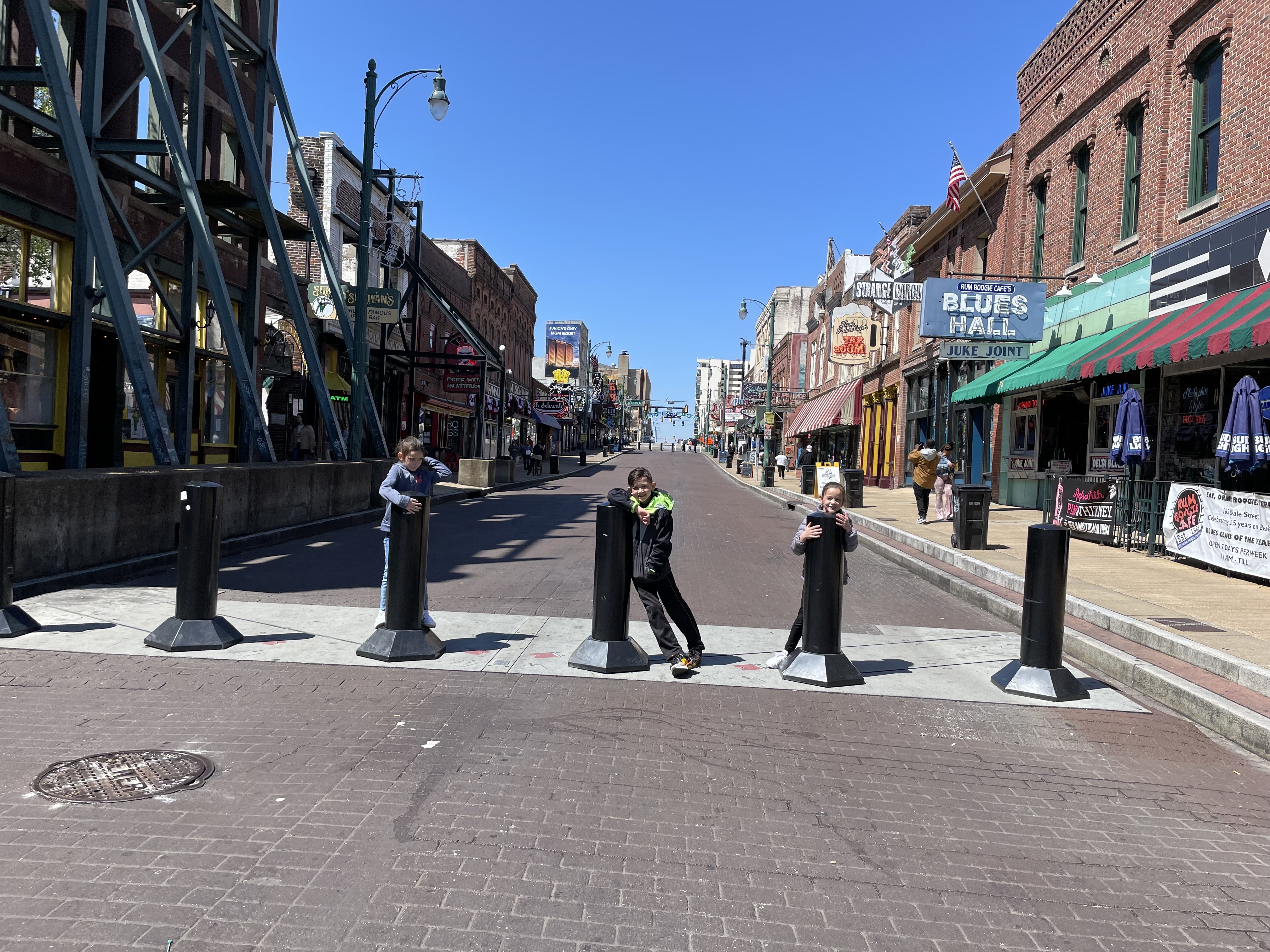 Kids exploring Beale Street in downtown Memphis Tennessee during a family road trip