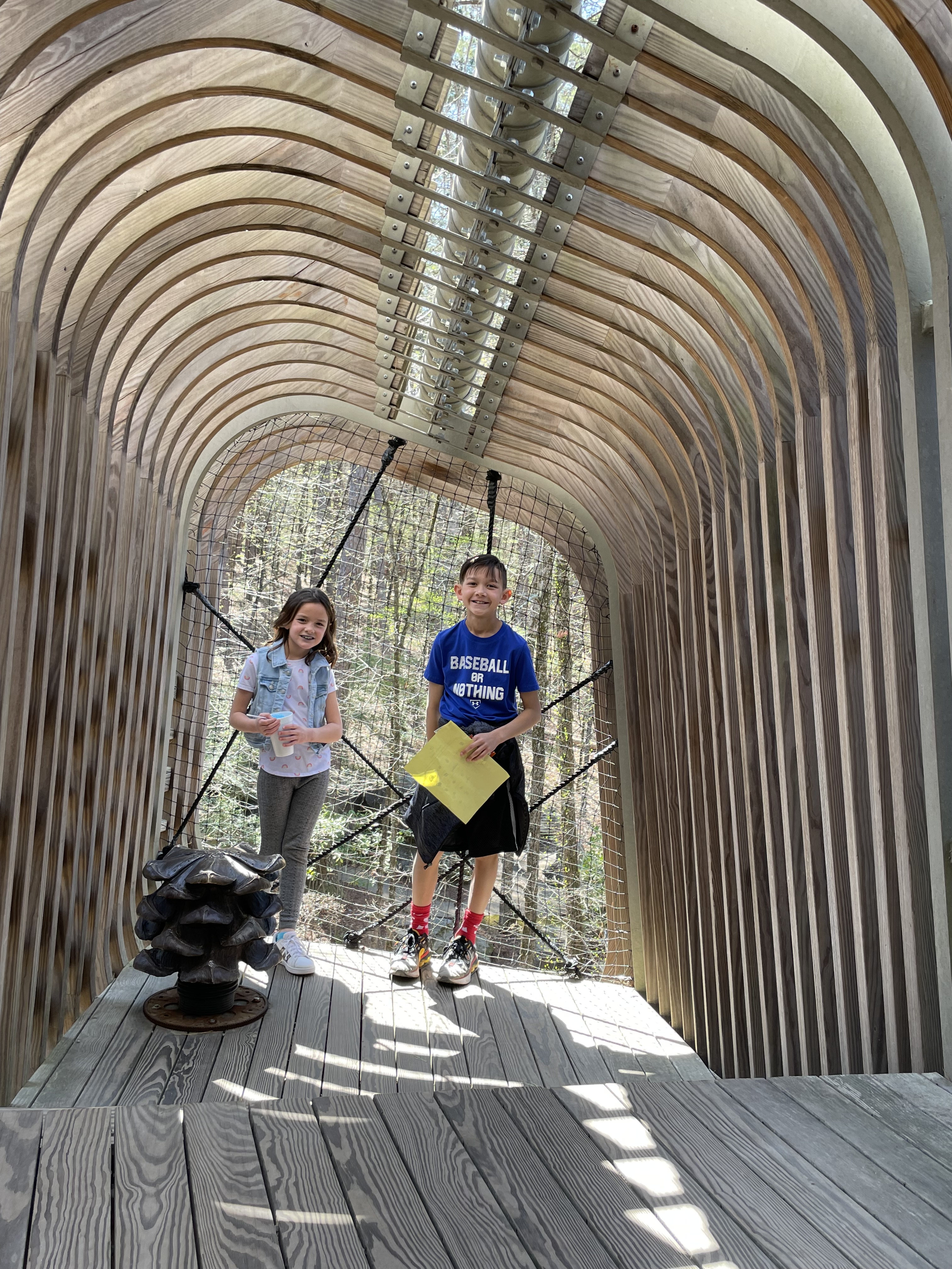 Kids exploring the treehouse at Garvan Woodland Gardens