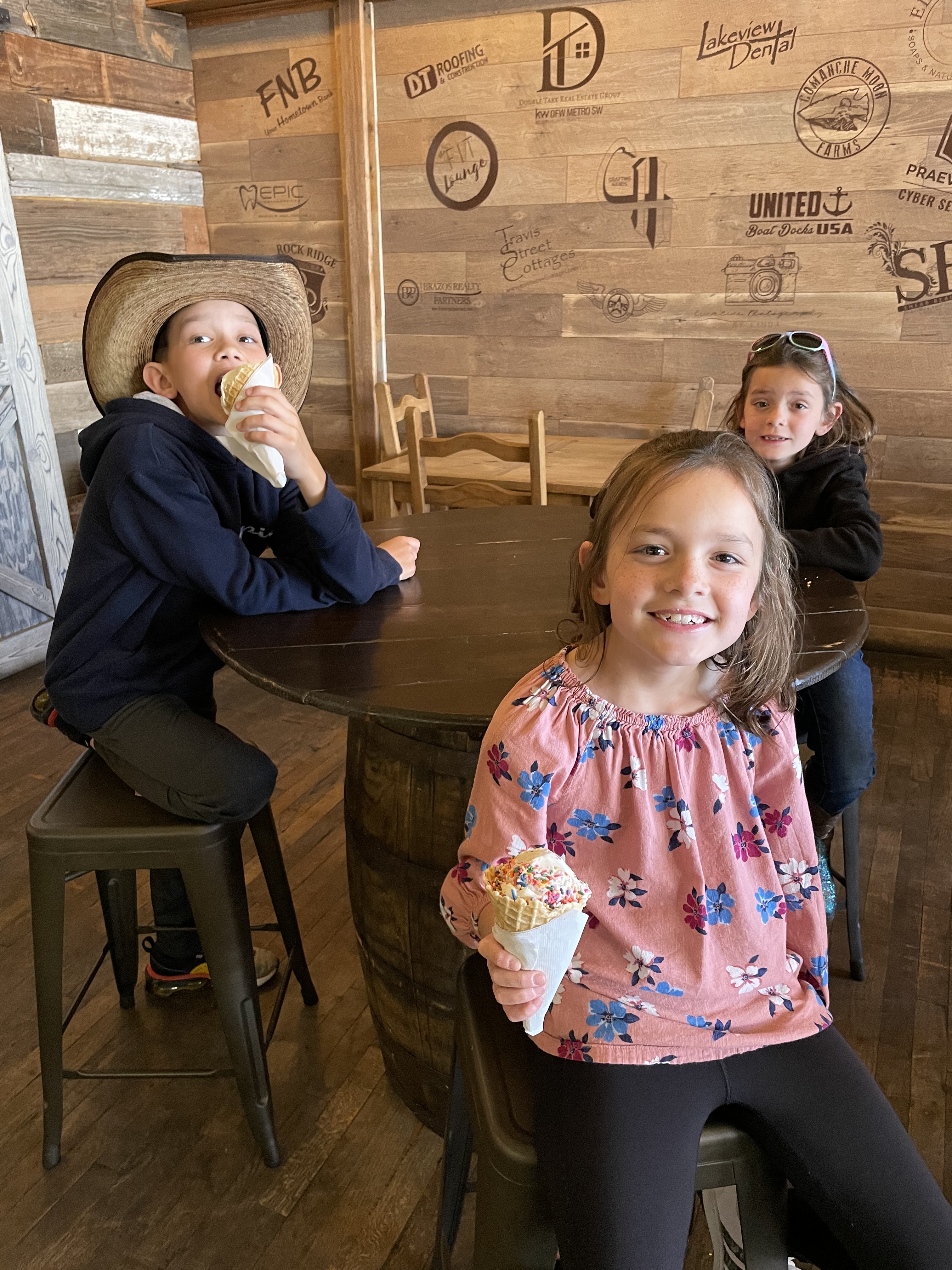 Family eating ice cream in historic downtown Granbury Texas