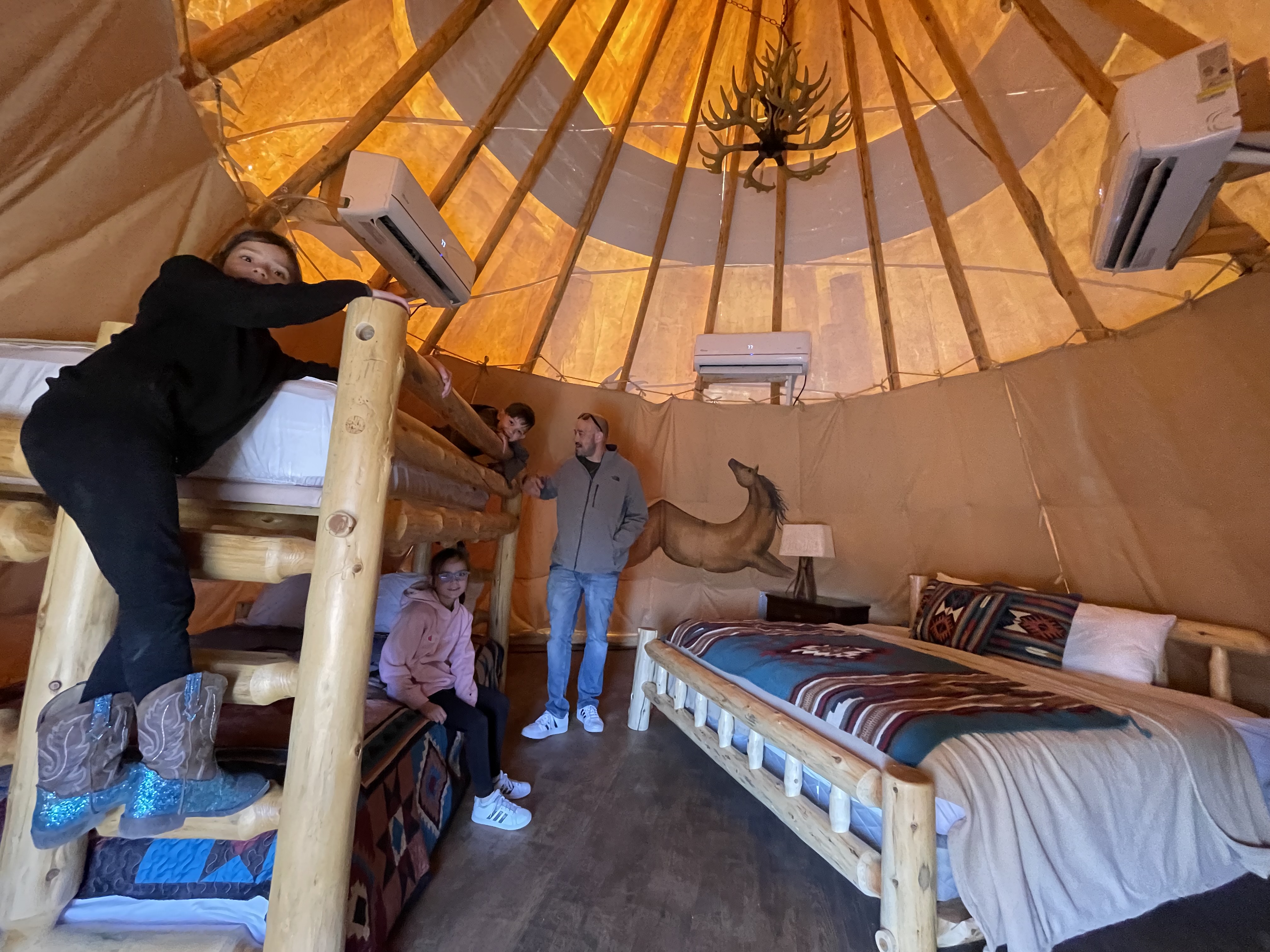 Family inside a teepee at Orr Family Farm in Oklahoma City