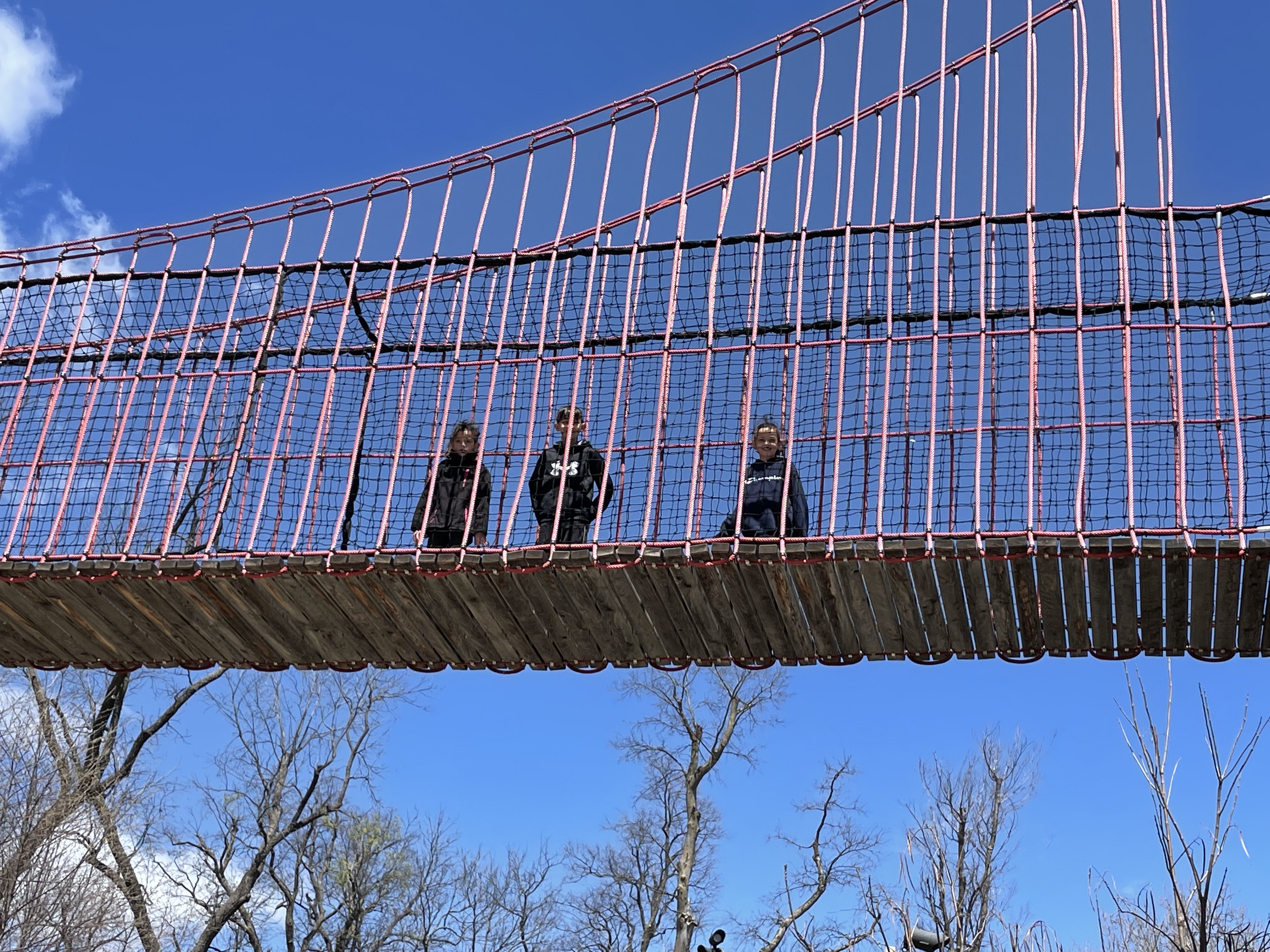 Kids climbing rope bridges at Scissortail Park in Oklahoma City