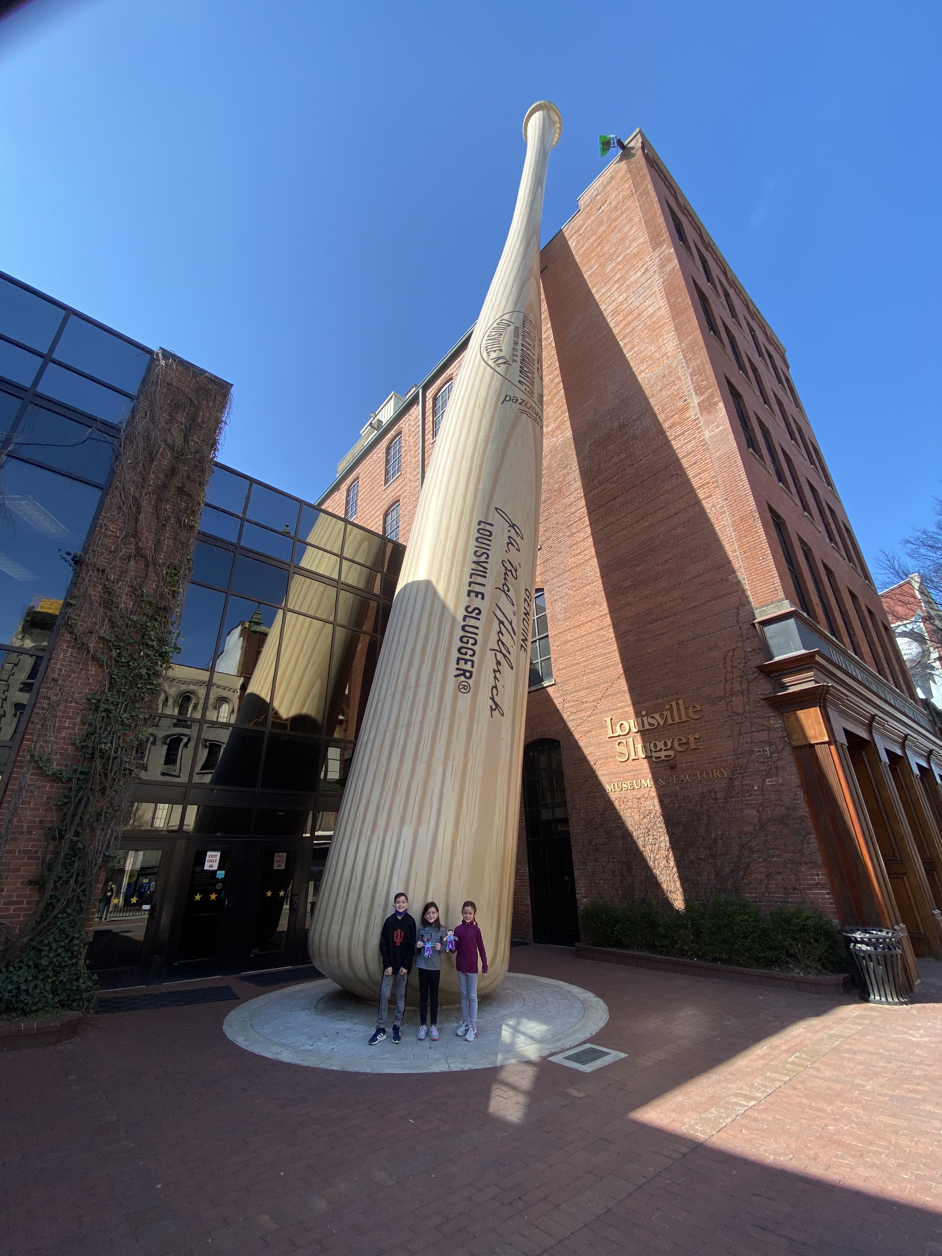 Family visiting the Louisville Slugger Museum and Factory during a Kentucky family road trip