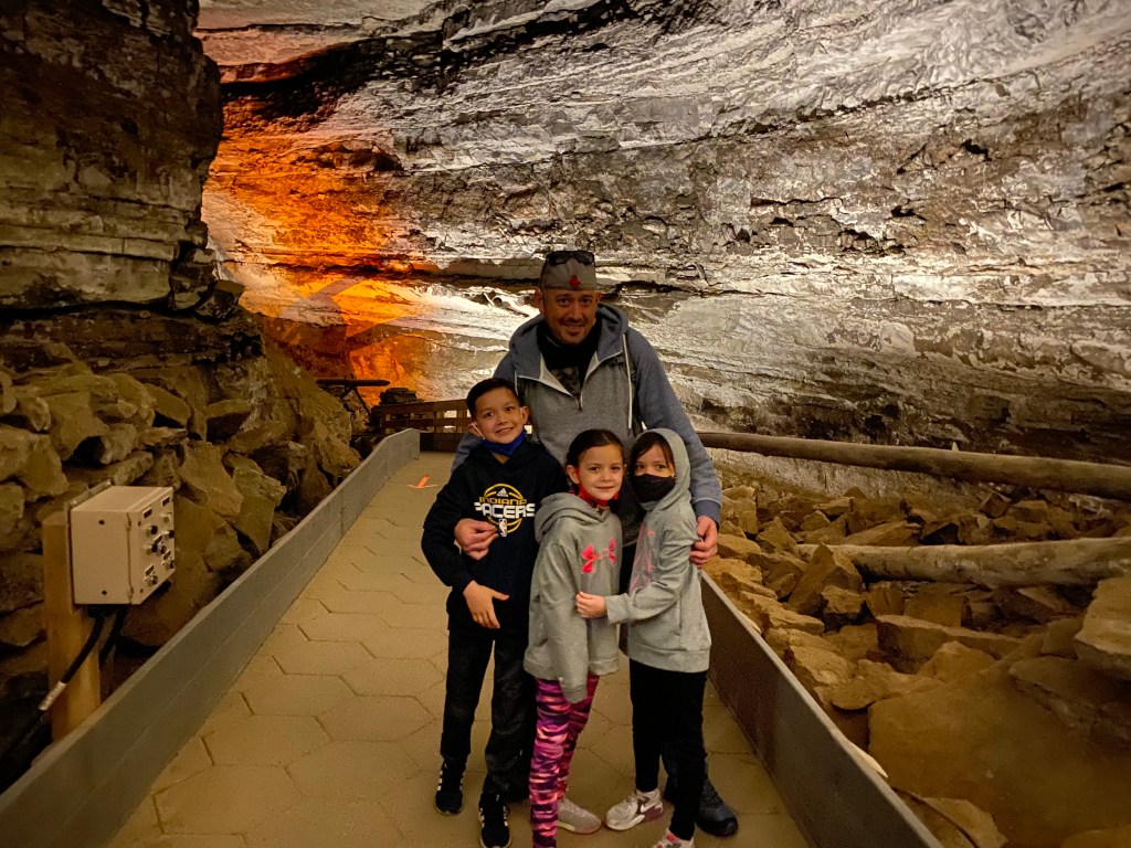 Family photo inside Mammoth Cave National Park in Kentucky