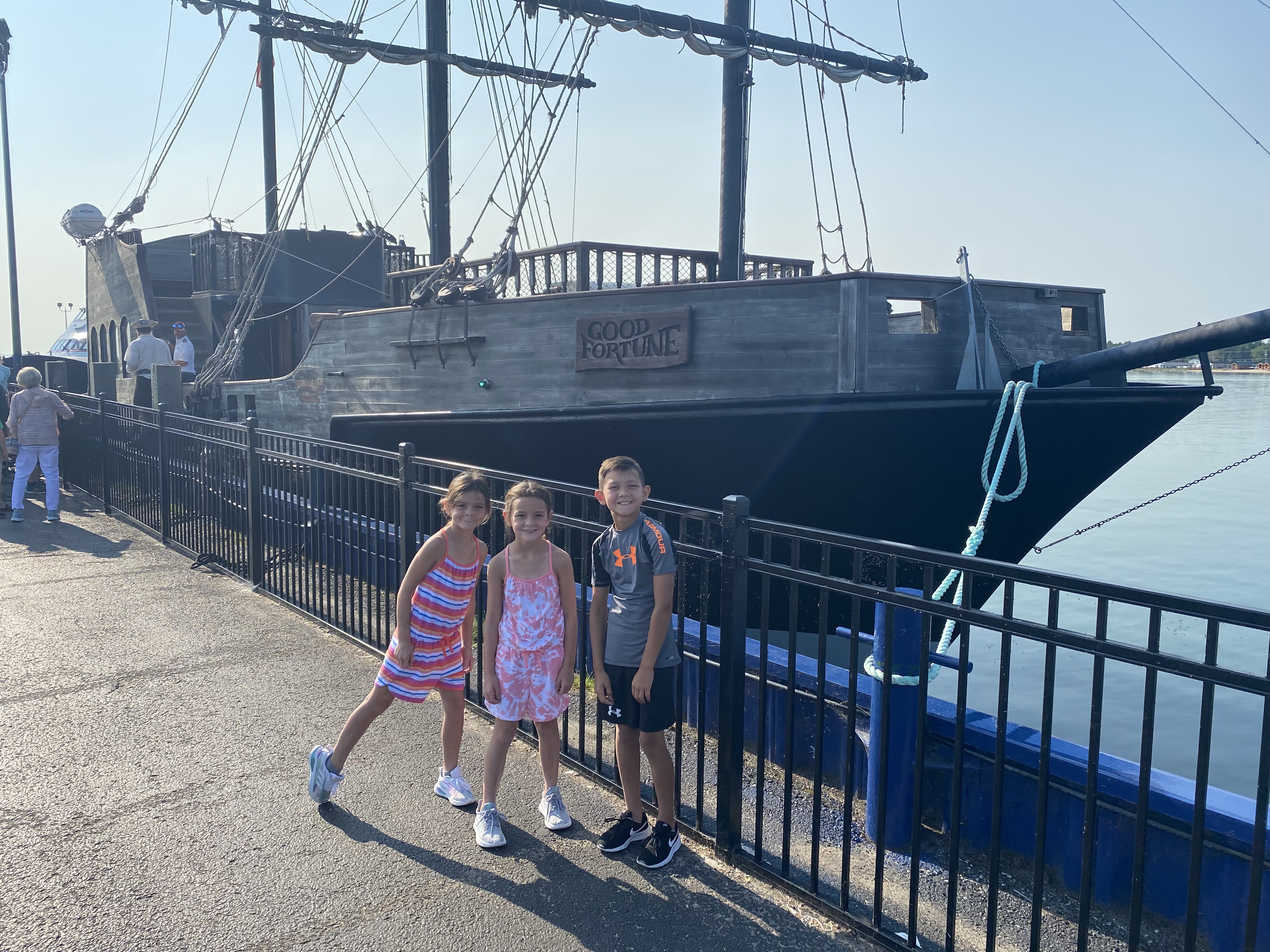Kids standing in front of the Good Fortune Pirate Ship ferry near Mackinac Island