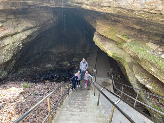 Family standing near the entrance stairs at Mammoth Cave National Park
