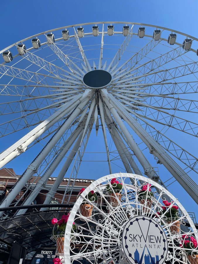 SkyView Atlanta Ferris wheel against a blue sky in downtown Atlanta