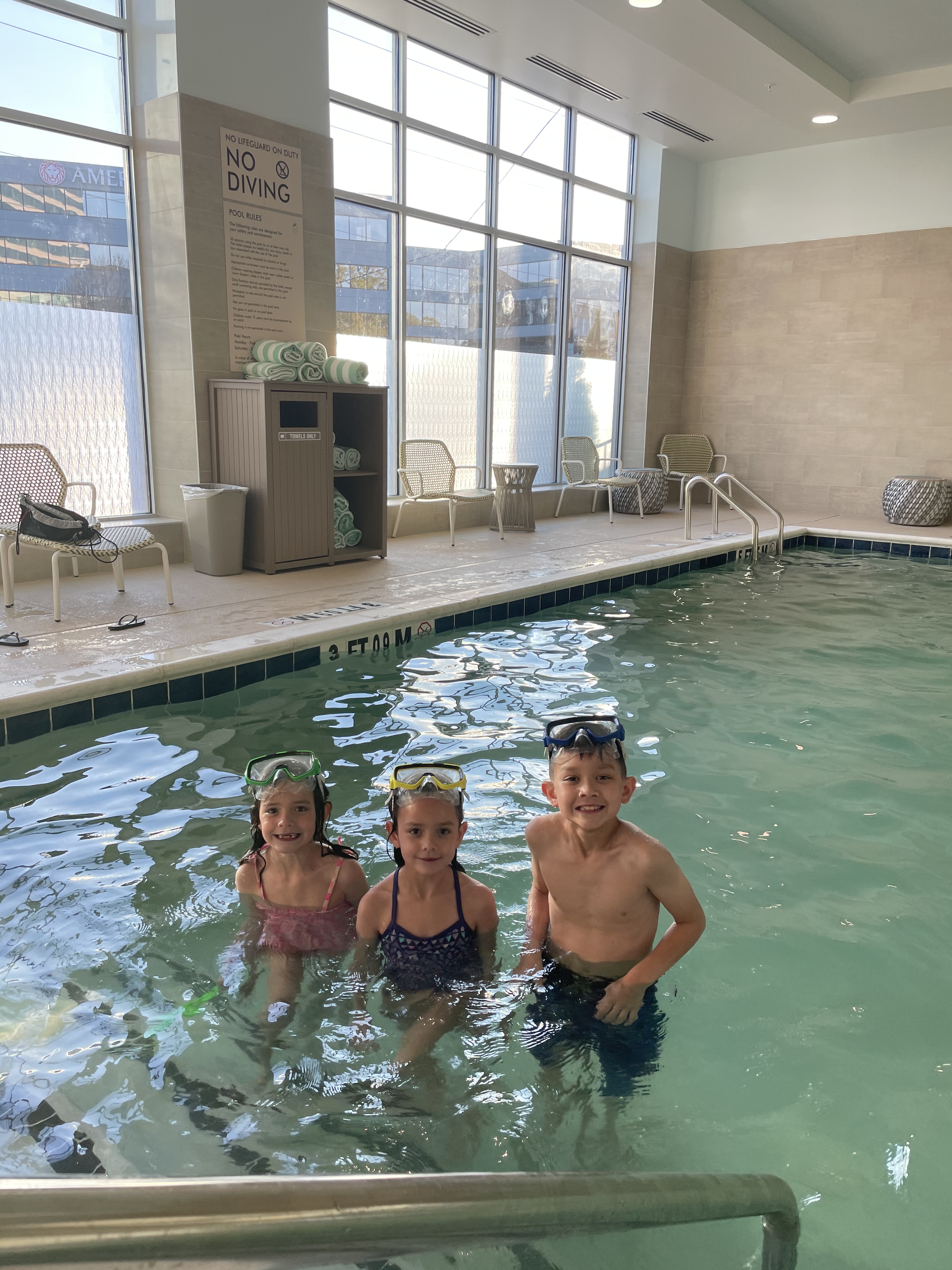 Kids swimming at Element Atlanta Buckhead hotel pool during a family trip to Atlanta