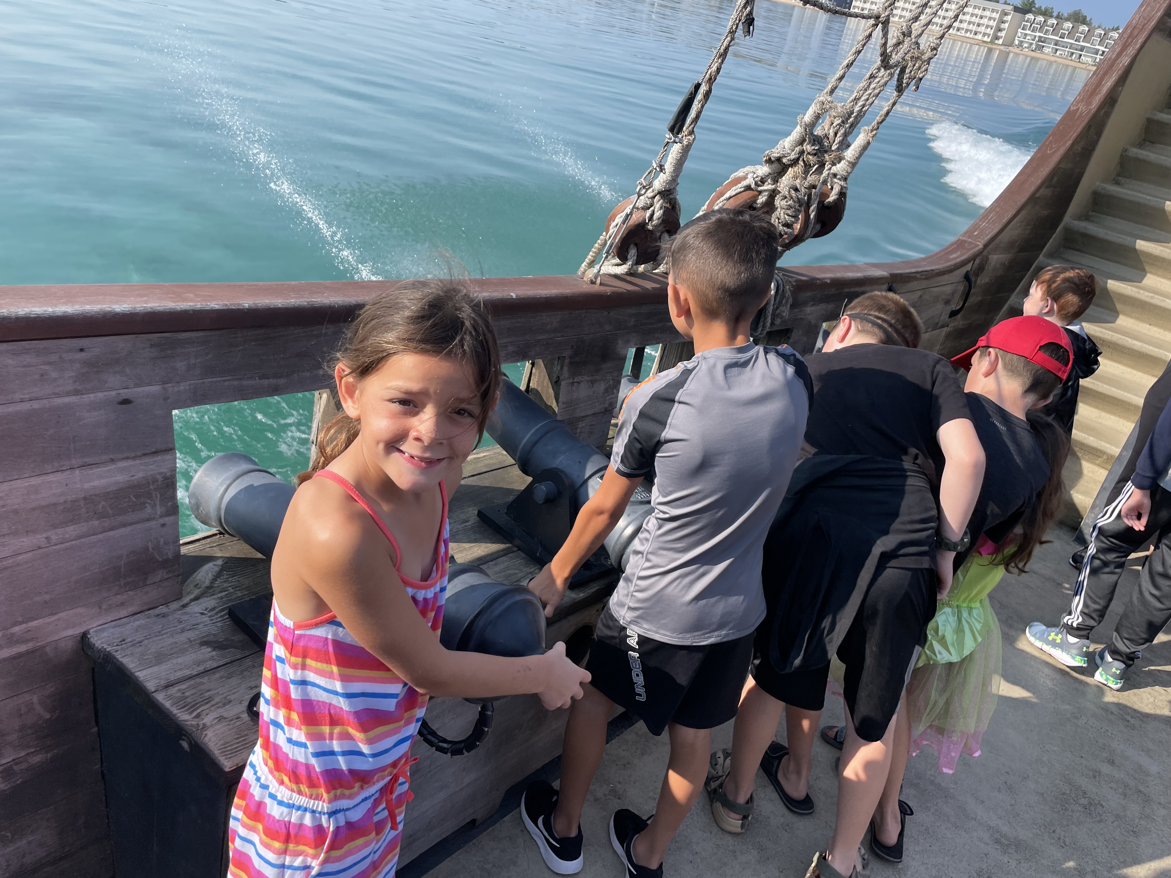 Kids pretending to fire a cannon on the Good Fortune Pirate Ship ferry to Mackinac Island