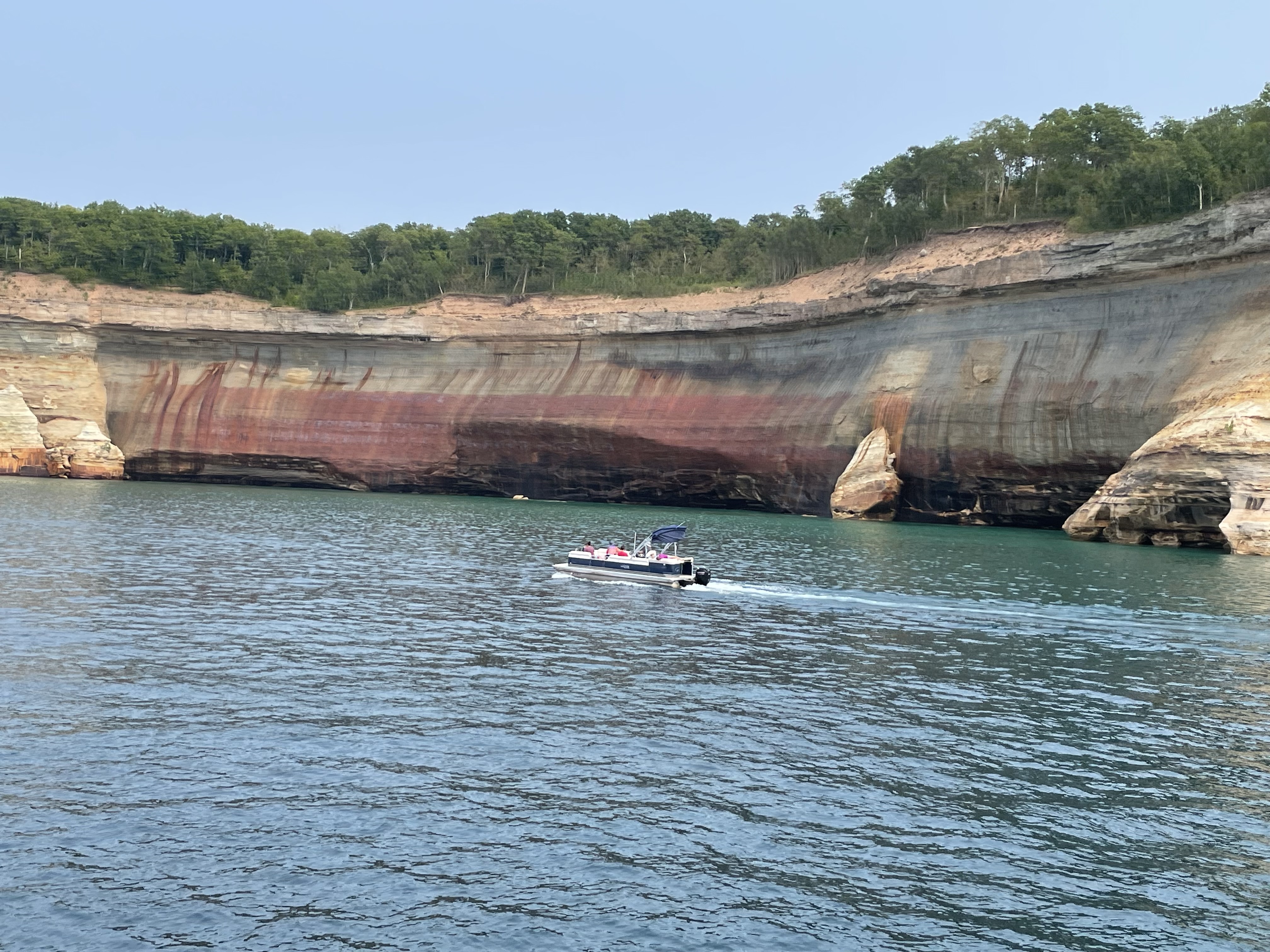 Colorful sandstone cliffs along Lake Superior during a Pictured Rocks boat tour in Michigan