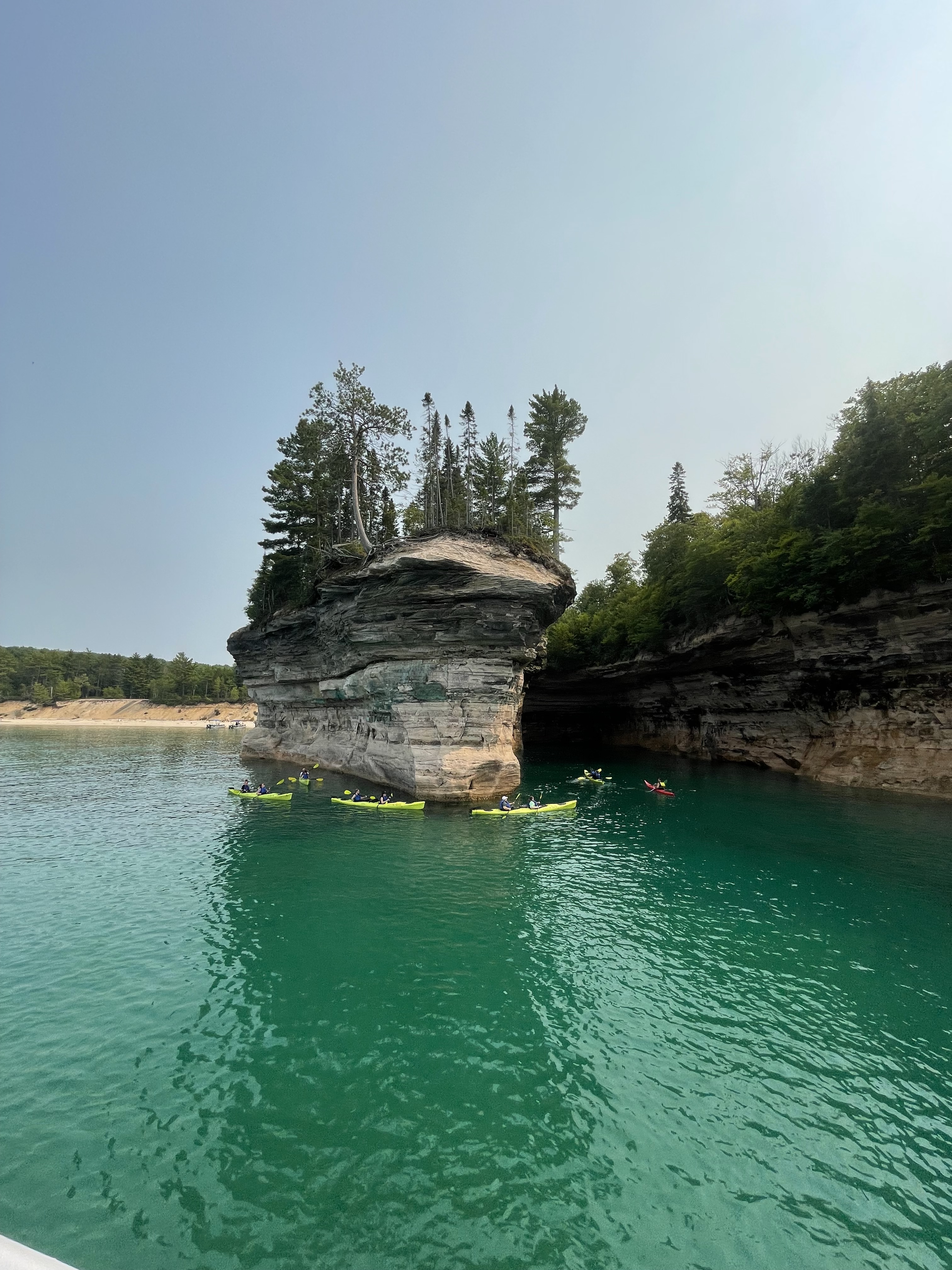 Pictured Rocks boat tour with turquoise Lake Superior water and sandstone cliffs in Michigan